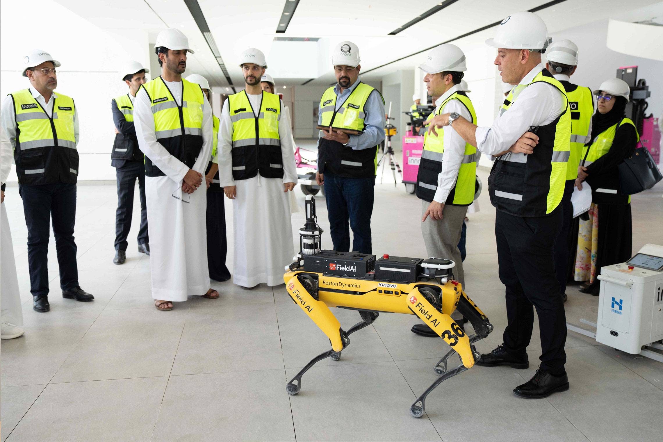 UAE officials watch a quadruped robot demonstration on an Innovo construction site