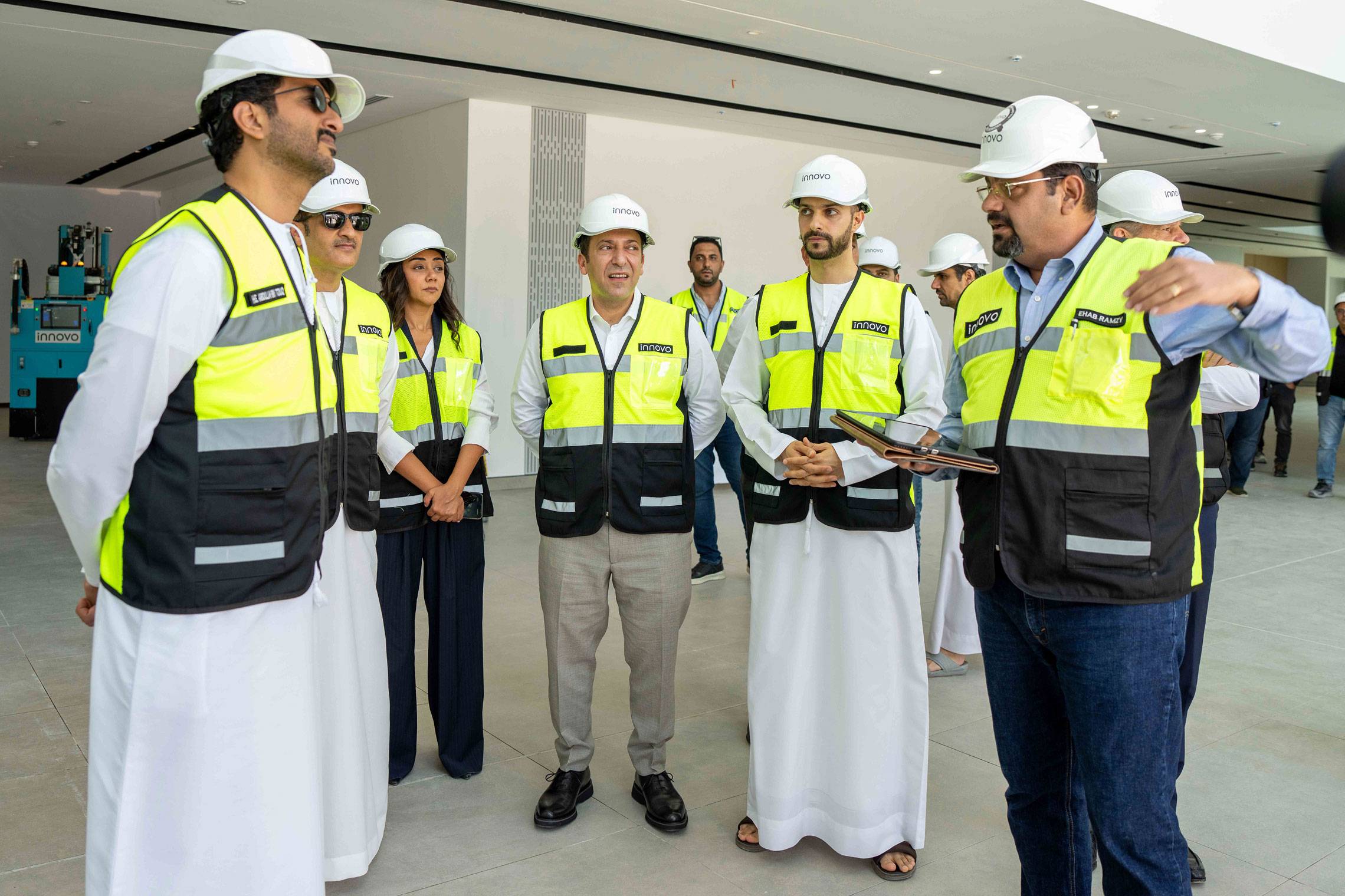 H.E. Abdulla bin Touq tours an Innovo construction site in Dubai with engineers in PPE